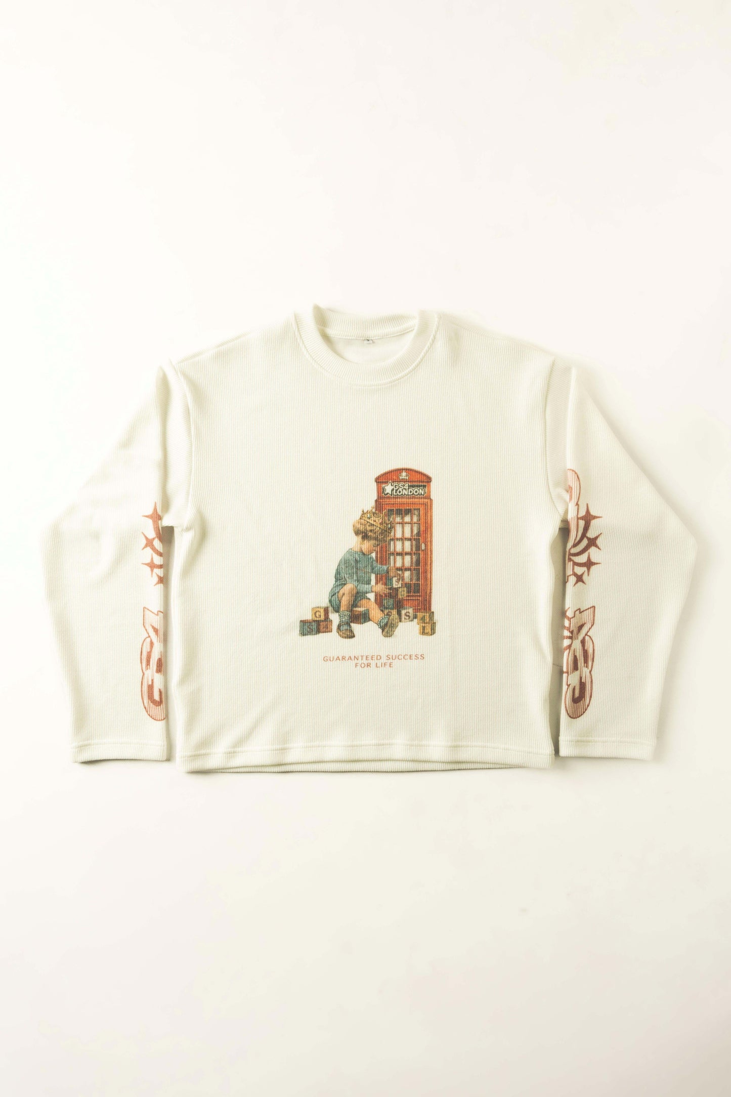 White long-sleeve shirt with a graphic design of a child and a telephone booth on a white background