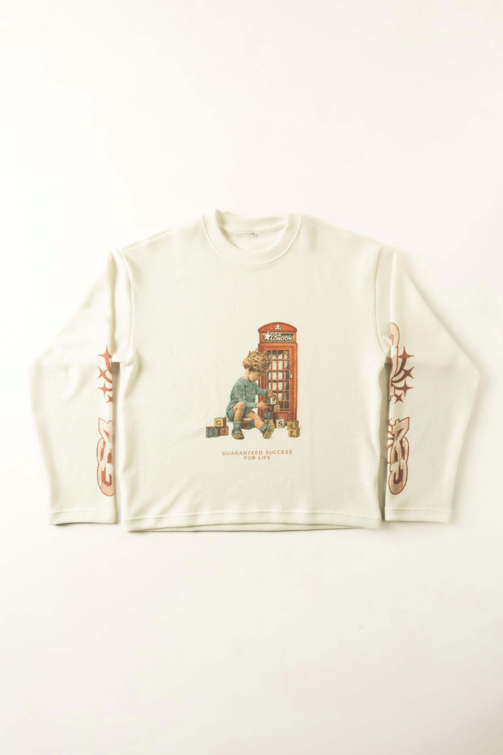 White long-sleeve shirt with a graphic design of a child and a telephone booth on a white background