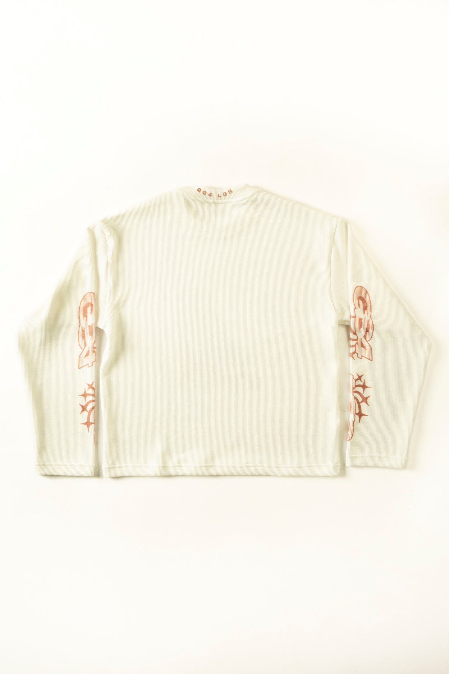 White sweater with red patterns on a white background