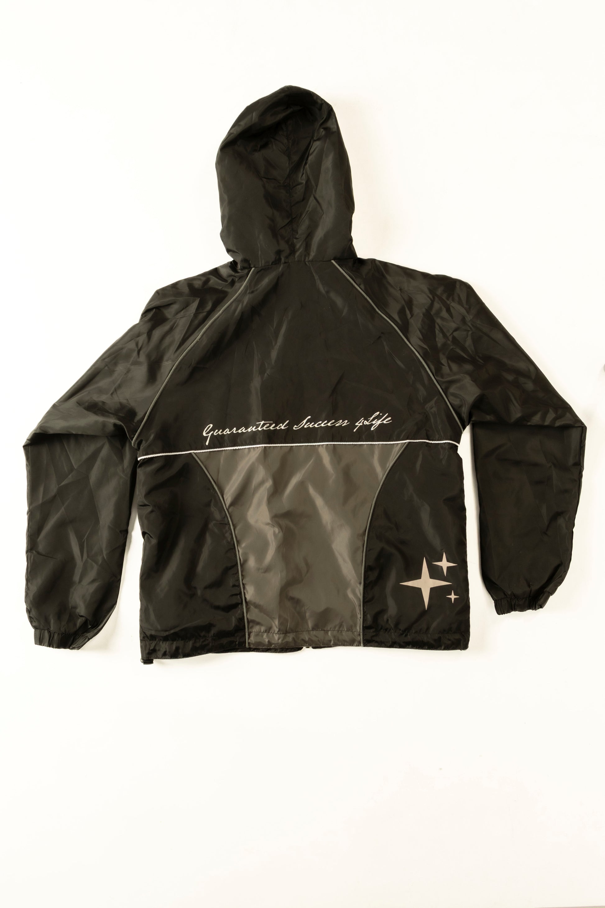 Black jacket with white text and logo on a white background